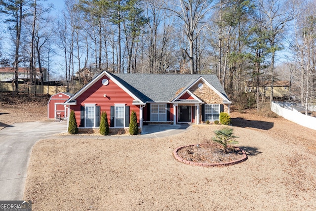 view of front of house with a storage shed