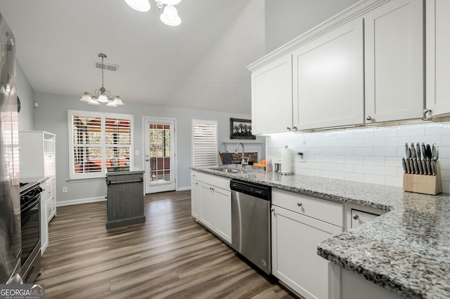 kitchen with white cabinetry, appliances with stainless steel finishes, and light stone counters