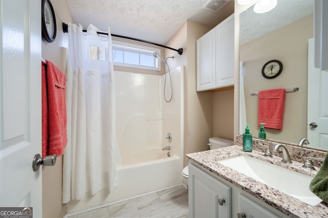 full bathroom featuring vanity, toilet, a textured ceiling, and shower / bath combo with shower curtain