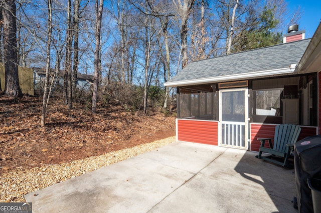 view of patio with a sunroom