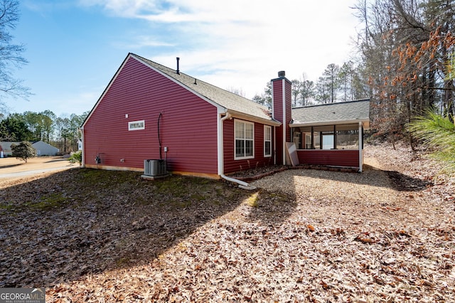 view of side of home featuring central air condition unit