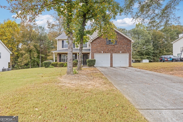 front of property with a garage, a front yard, and central air condition unit