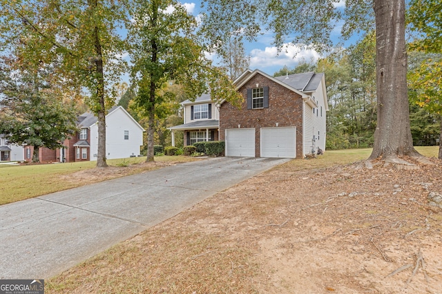 view of front property with a garage and a front lawn