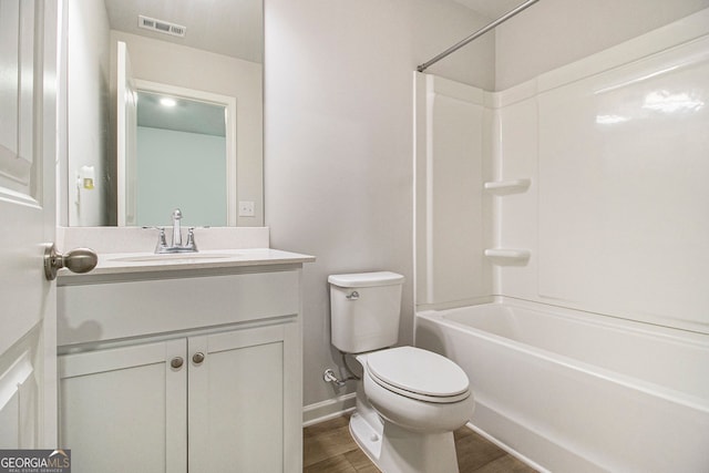 full bathroom with shower / tub combination, wood-type flooring, vanity, and toilet