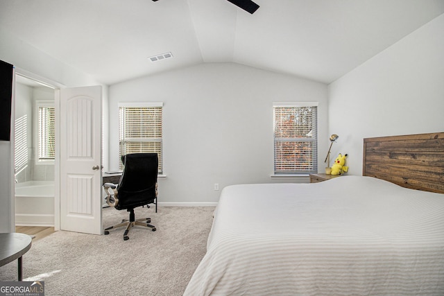 bedroom with ceiling fan, vaulted ceiling, and light carpet