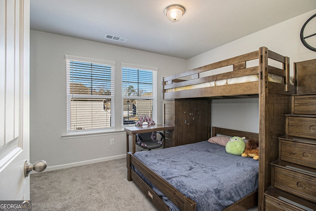 bedroom featuring light carpet