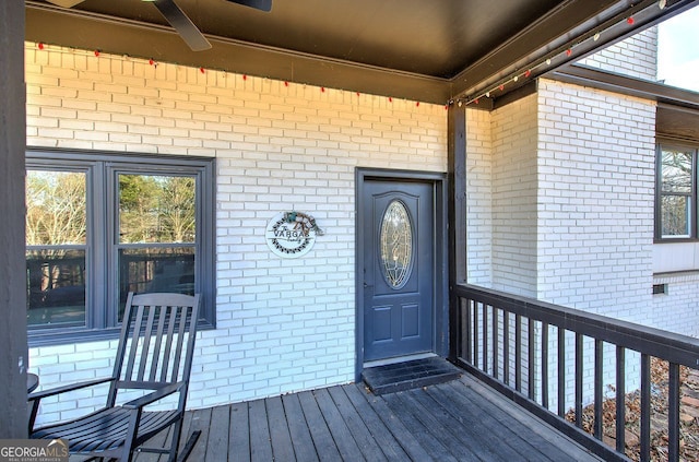 view of exterior entry with ceiling fan