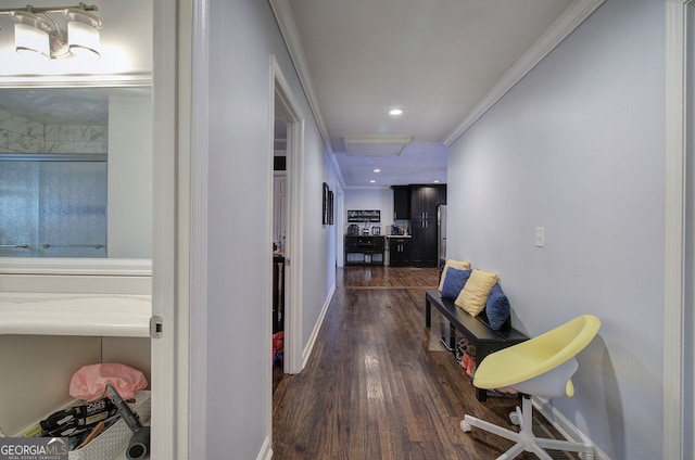 hallway featuring crown molding and dark hardwood / wood-style flooring