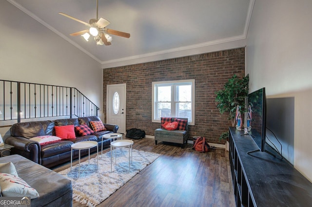 living room with high vaulted ceiling, dark wood-type flooring, and ornamental molding