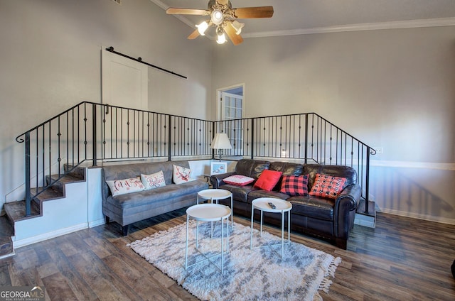 living room with ornamental molding, high vaulted ceiling, dark hardwood / wood-style floors, and ceiling fan