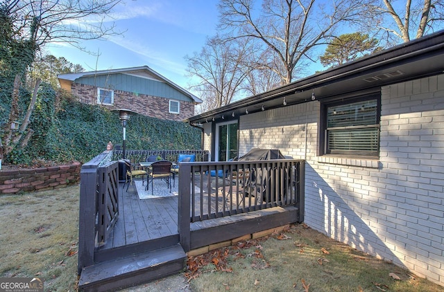 wooden deck with a yard