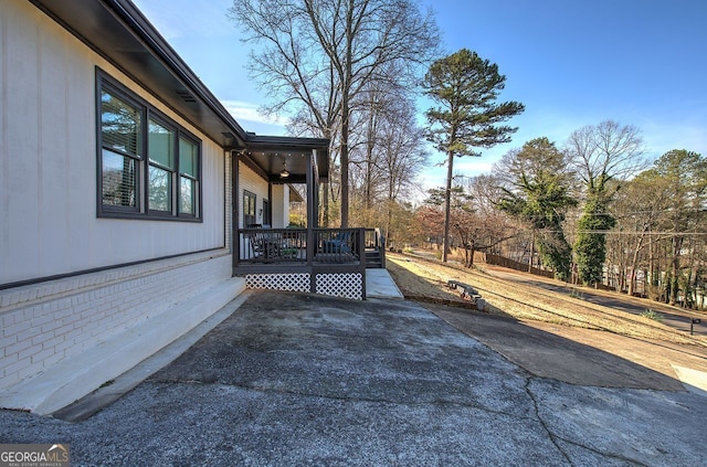 view of property exterior with a patio