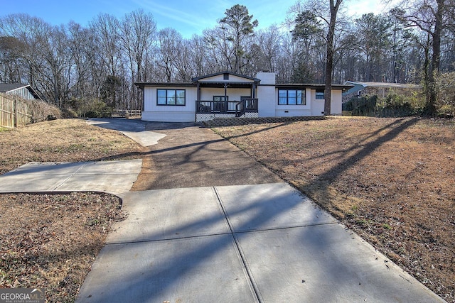 single story home featuring covered porch