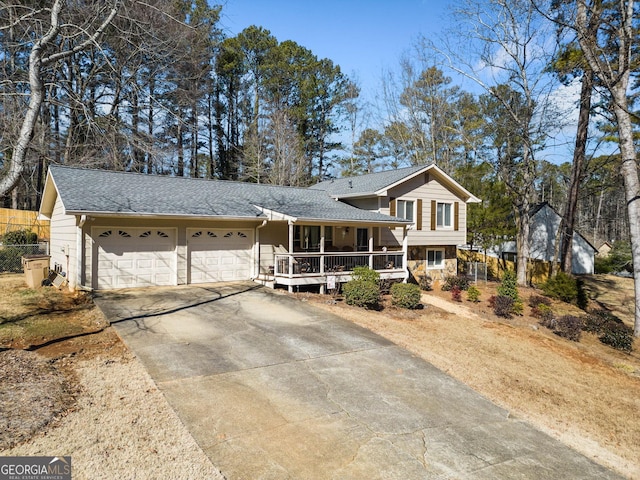 view of front facade with a garage and a porch