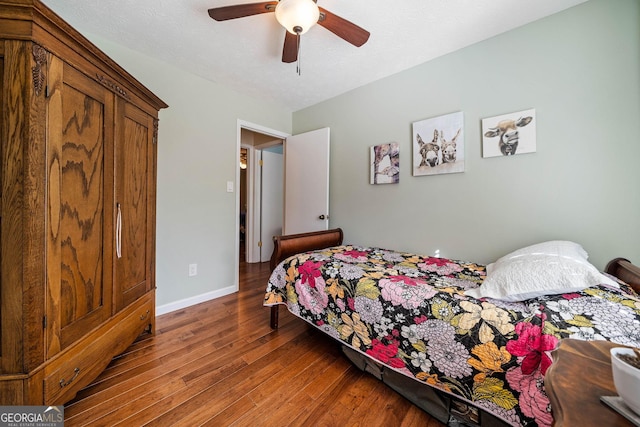 bedroom with ceiling fan and hardwood / wood-style floors