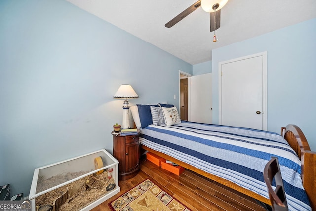 bedroom with hardwood / wood-style floors and ceiling fan