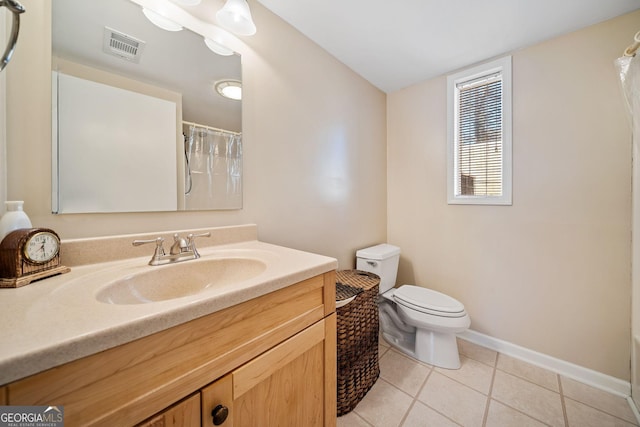 bathroom with a shower with shower curtain, vanity, toilet, and tile patterned flooring