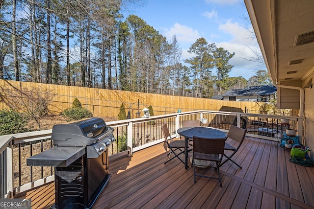 wooden deck featuring grilling area