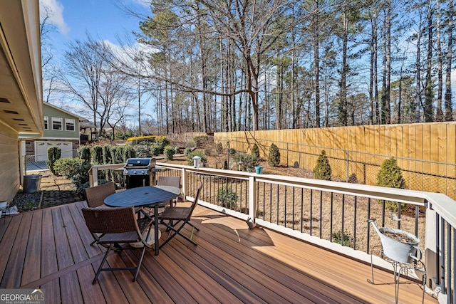 wooden deck featuring grilling area