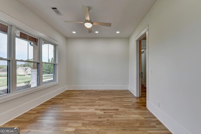 unfurnished room featuring light hardwood / wood-style flooring and ceiling fan