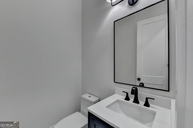 bathroom with vanity and toilet