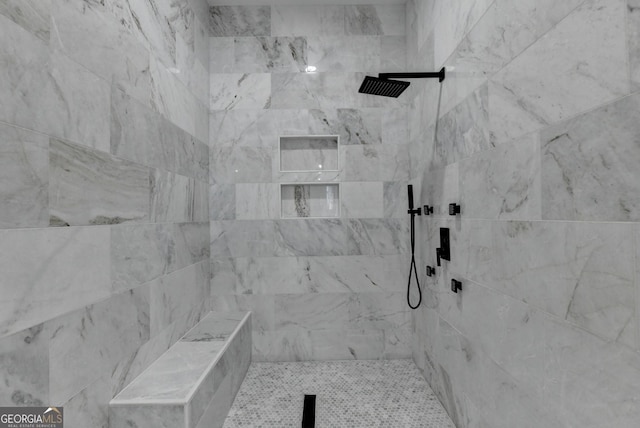 bathroom featuring tiled shower