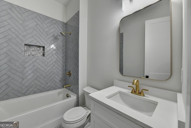 full bathroom featuring vanity, toilet, and tiled shower / bath combo