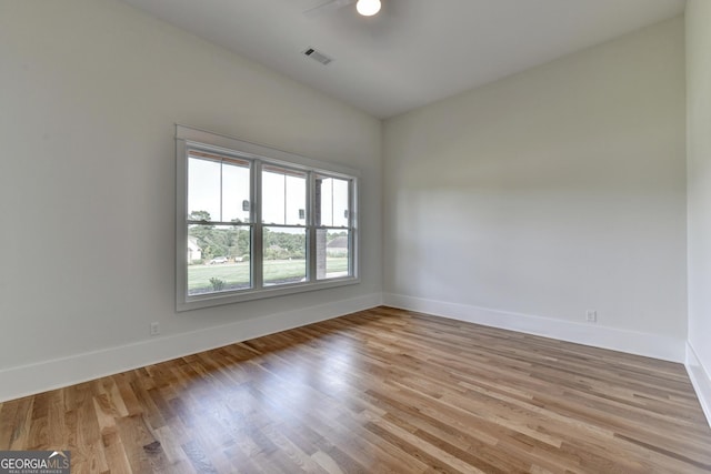 spare room featuring light hardwood / wood-style floors