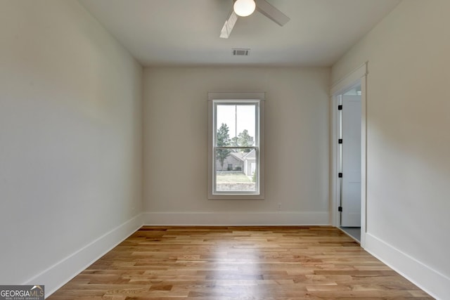 unfurnished room featuring ceiling fan and light wood-type flooring