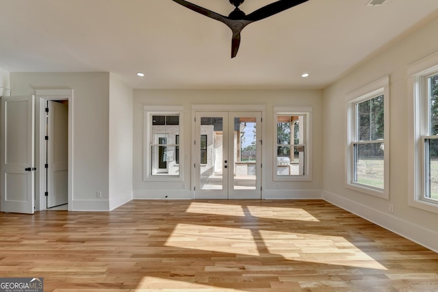 interior space with light hardwood / wood-style flooring and french doors