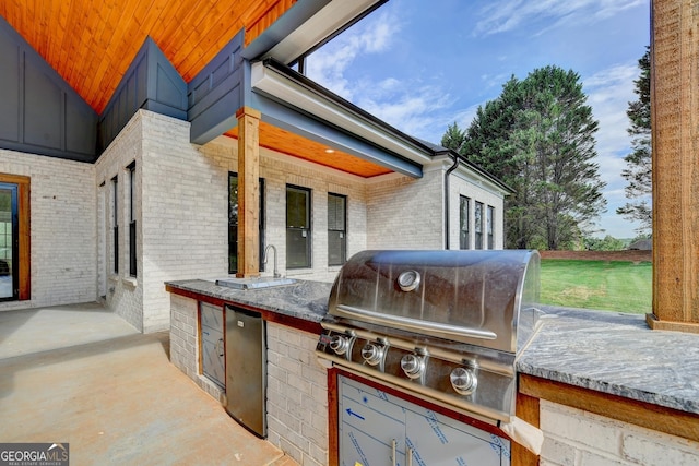 view of patio with a grill and area for grilling