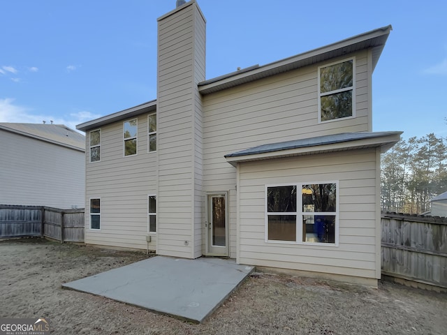 back of property featuring a patio