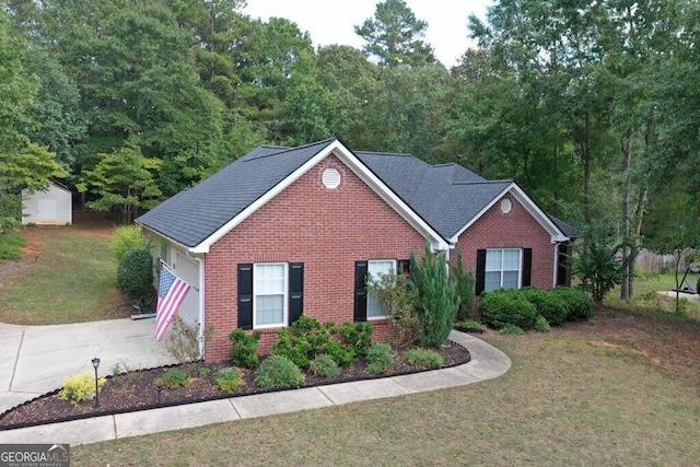 view of front of home with a shed and a front yard