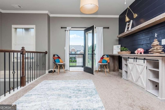 interior space featuring crown molding and carpet floors