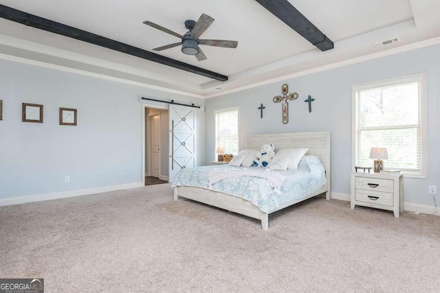 carpeted bedroom featuring ceiling fan, beam ceiling, ornamental molding, a raised ceiling, and a barn door