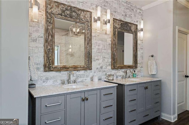 bathroom featuring ornamental molding and vanity