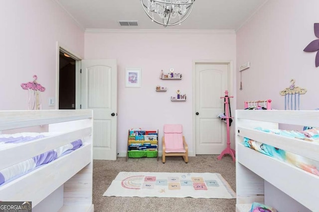 bedroom with an inviting chandelier and ornamental molding