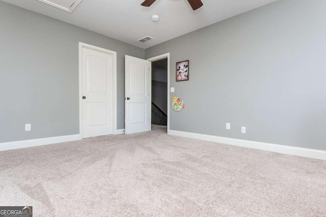 unfurnished bedroom featuring ceiling fan and carpet floors