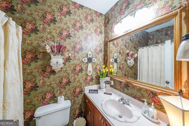 bathroom with vanity and toilet