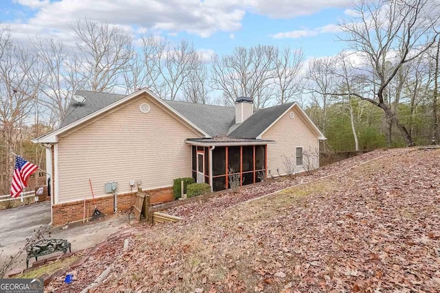 back of house with a sunroom