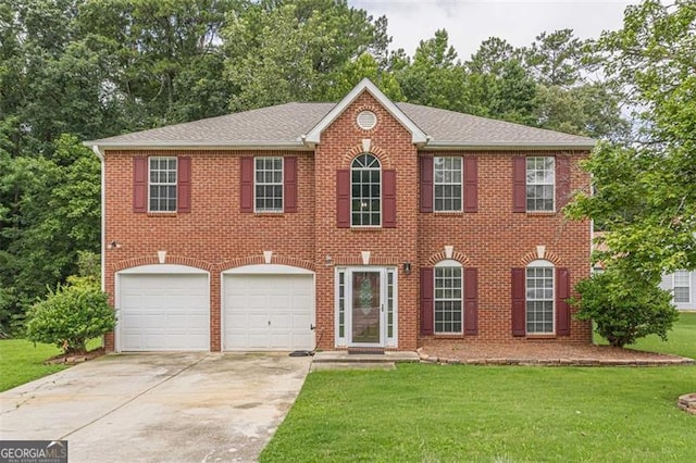 colonial-style house featuring a garage and a front yard