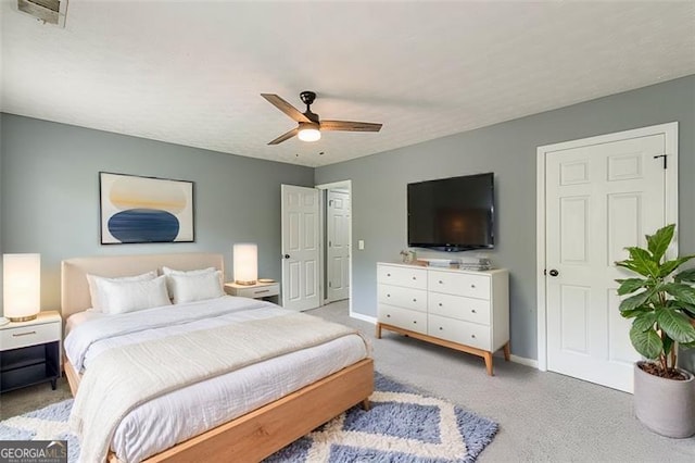 bedroom featuring ceiling fan and light colored carpet