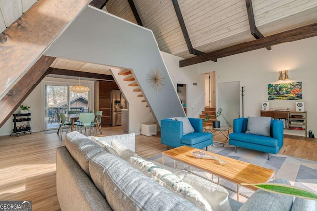 living room with beamed ceiling, wood ceiling, high vaulted ceiling, and light wood-type flooring