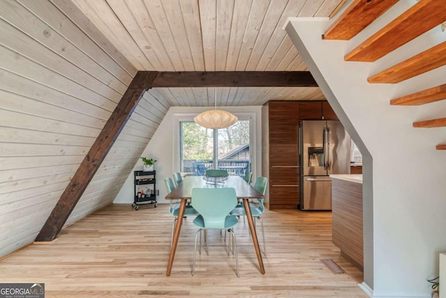 dining area featuring wood ceiling, vaulted ceiling with beams, and light wood-type flooring