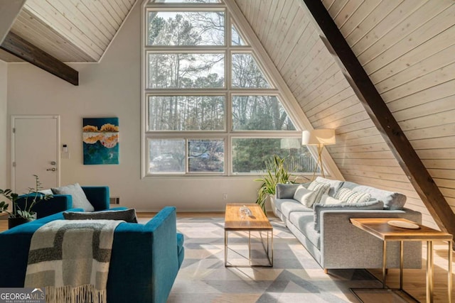 living room featuring beamed ceiling, wooden ceiling, and high vaulted ceiling