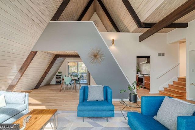 living room featuring beamed ceiling, high vaulted ceiling, light hardwood / wood-style floors, and wooden ceiling