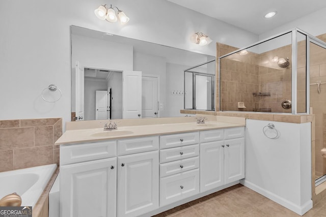 bathroom featuring vanity, tile patterned floors, and separate shower and tub