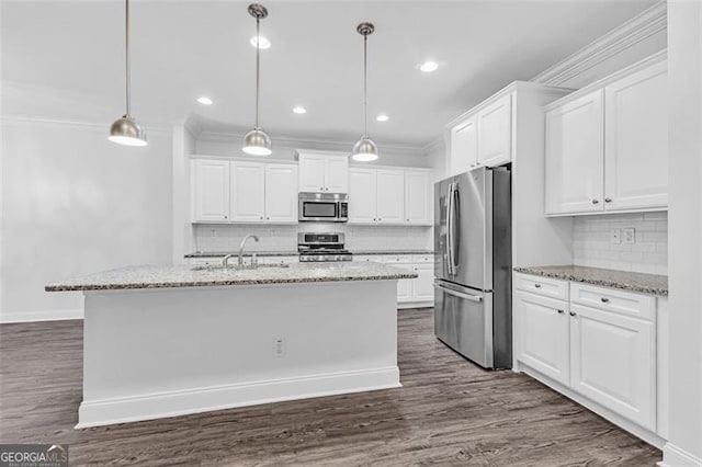 kitchen featuring white cabinetry, a kitchen island with sink, light stone countertops, and appliances with stainless steel finishes