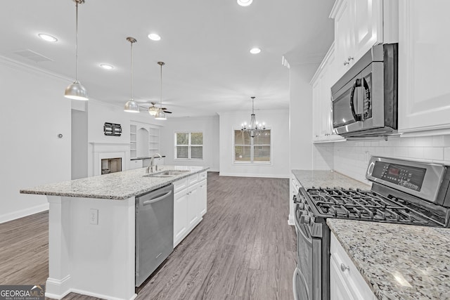 kitchen with appliances with stainless steel finishes and white cabinets