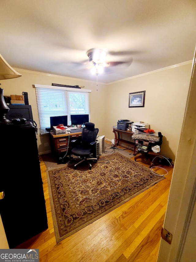 office area with crown molding, ceiling fan, and light hardwood / wood-style flooring